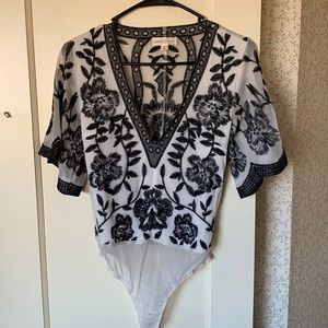 Honey Punch. Black and white stitched bodysuit. Size small. Super flattering.